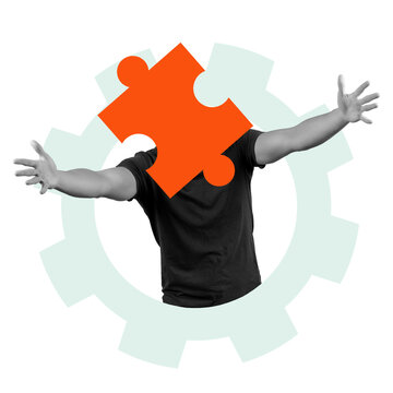 A figure stands with a large orange puzzle piece as a head. The figure's arms are extended outwards. A gear shape is in the background. The image has a transparent background.