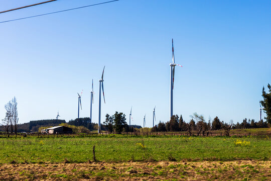 Wind Turbines on Grassy Field with Rural Barn Biob&iacute;o Chile