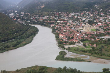 Aerial View of Historic Mtskheta Town and Svetitskhoveli Cathedral by River in Georgia © UMIT