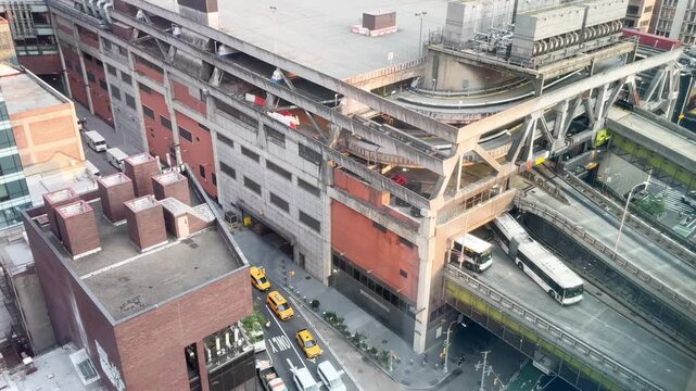 Pigeons flock flying out of Port Authority bus terminal NYC sunny day