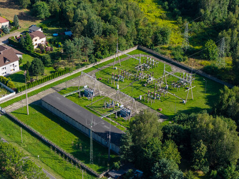 Aerial view showing electrical power station substation generating green energy