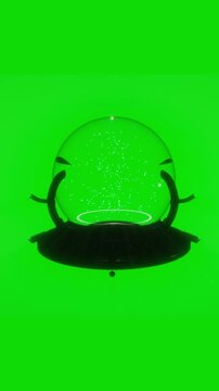 Empty glass snow globe with dark metallic pedestal floats displaying glowing white particles inside against a green screen in a 3D loop