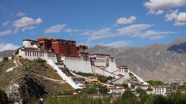 Potala Palace in Lhasa, Tibet, majestic red and white fortress monastery on Marpo Ri hill under blue sky with scattered clouds
