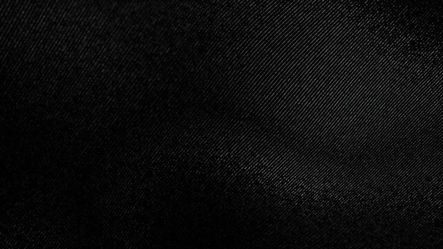Abstract dark textured background featuring a subtle granular pattern with fine diagonal noise, creating a minimalist monochrome surface suitable for modern design, technology, and luxury 