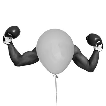 A balloon takes the shape of a head while two muscular arms in boxing gloves are raised, showcasing a playful and imaginative scene. This image captures a unique concept blending strength and fun.