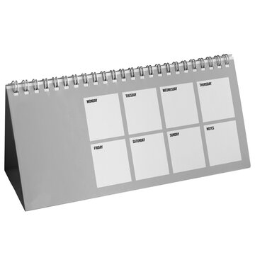 A calendar sits on a table with sections labeled for each day. It shows space for notes. This calendar is designed to help with organization and scheduling.