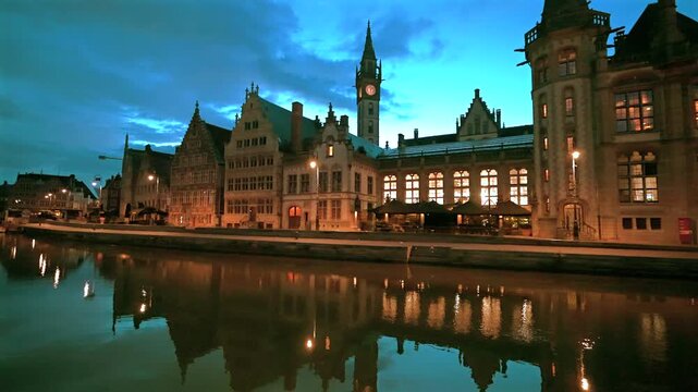 Medieval buildings reflected in the River Lys canal in Ghent, Graslei quayside, Belgium