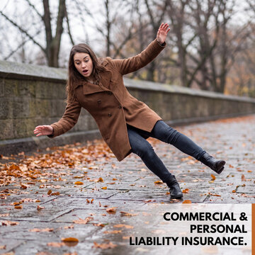 Woman in a brown winter coat slips and falls backward on a wet outdoor stone walkway during autumn.