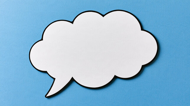 A white paper speech bubble with a black border lies on a blue textured background. Perfect for communication and advertising concepts.