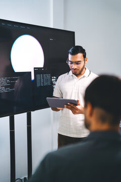 Adult indian engineer programmer presentation coding AI artificial intelligence algorithm coder training monitor developer expertise programming IT technology career