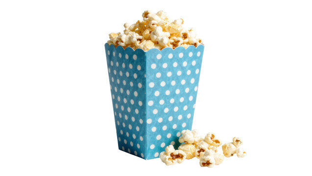 Blue polka dot popcorn box overflowing with fluffy popcorn, isolated on transparent background