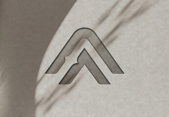 Debossed Logo Mockup on Concrete Wall with Shadows