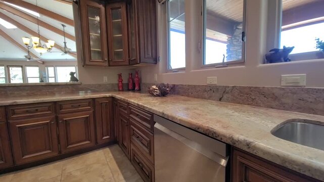 Bright kitchen with granite countertop and sink