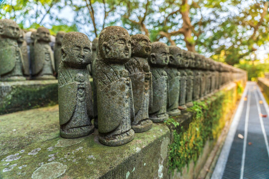 Stone Jizo statues in rows at Hase-dera temple in Kamakura Japan