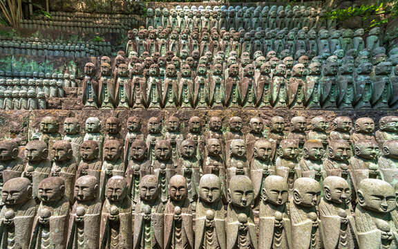 Rows of stone Jizo statues at Hase-dera temple in Kamakura Japan
