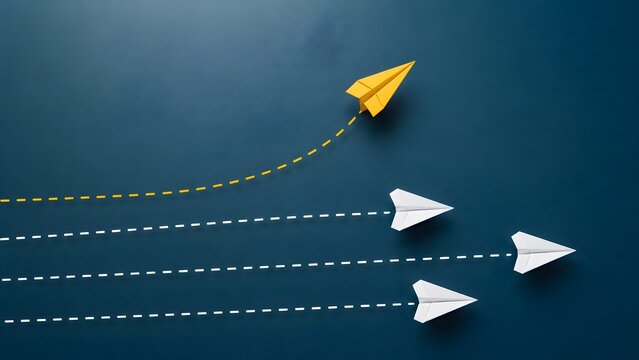 Yellow paper plane changing direction from a group of white planes on dark blue background symbolizing uniqueness thinking differently and leadership.