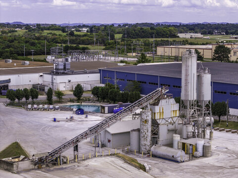 Aerial view of SRM Concrete Ready Mix Batching Plant featuring silos, conveyor belts, and industrial equipment in an urban industrial zone in Nashville, TN, United States.