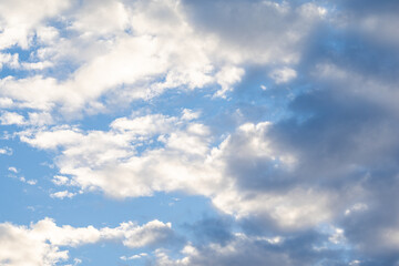 Obraz premium Fluffy white clouds in a bright blue sky cumulus clouds sun light