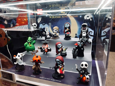 POP MART The Nightmare Before Christmas art toys displayed in retail showcase for Halloween featuring collectible figures spooky characters in themed art toy blind box mysterious box store