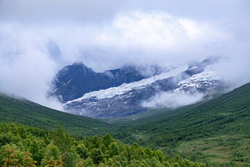 Obraz premium A beautiful summer mountain valley landscape near Norddal vilage. A seasonal scenery of World Heritage area in Western Norway.