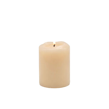 A single lit cream colored pillar candle with a small flickering flame isolated on a transparent background