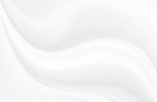 White gray satin texture that is white silver fabric silk background with beautiful soft blur pattern natural.