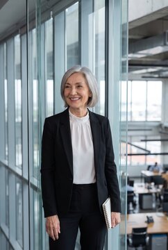 Senior businesswoman walking through office