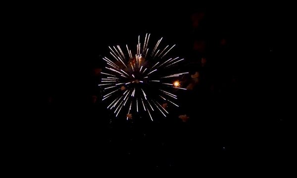 Colorful fireworks exploding in the night sky during a celebration or festive holiday event explosion festival new year fourth of july independence day pyrotechnics light