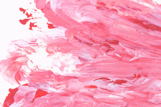 Flowing pink and white abstract paint texture with soft movement