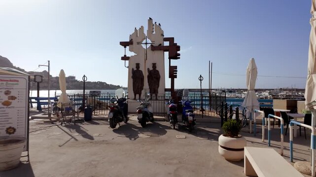 Statue of Saints Cosmas and Damian in Sferracavallo harbor, Sicily, Italy