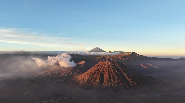 Aerial Pullback from Mount Bromo Volcano Above the Clouds, East Java Indonesia.