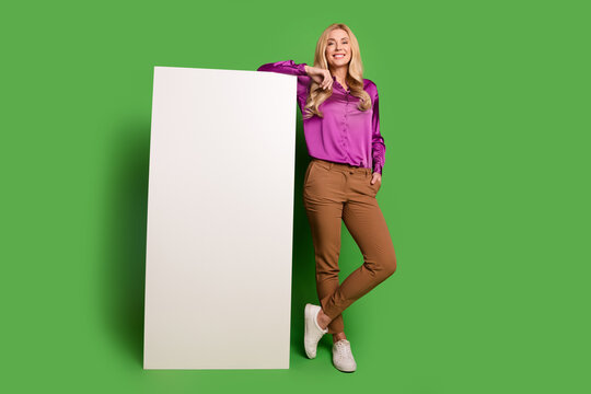 Full length photo of pretty positive lady dressed blouse chatting instagram twitter telegram facebook empty space isolated green color background