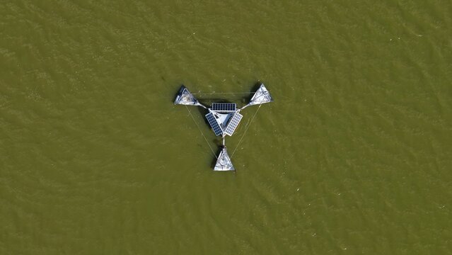 Aerial view of a floating solar-powered water aeration system on Gaynor Lake in Boulder County, Colorado, United States.