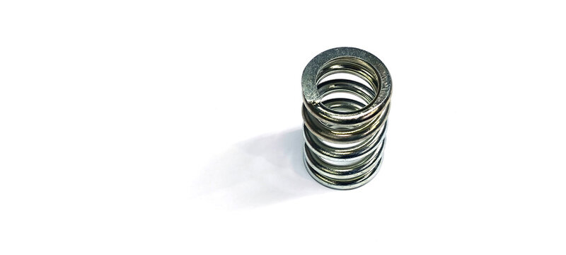 A spring is a device made of metal coiled into a loop. It has the property of being elastic and returning to its original shape when a force is applied.