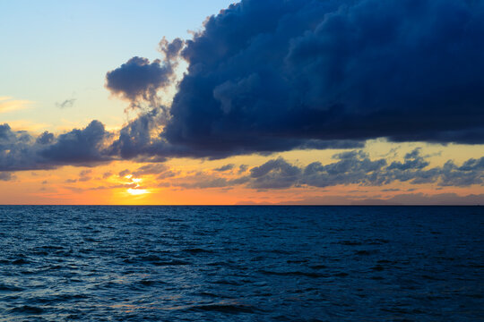 calm evening sea water and dusk lighting with cloudscape