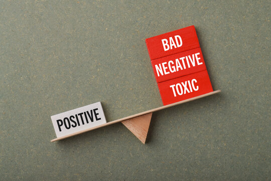 Balance scale contrasting positive with bad, negative, and toxic concepts, symbolizing mindset, attitude, emotional impact, personal choices, and psychological balance.