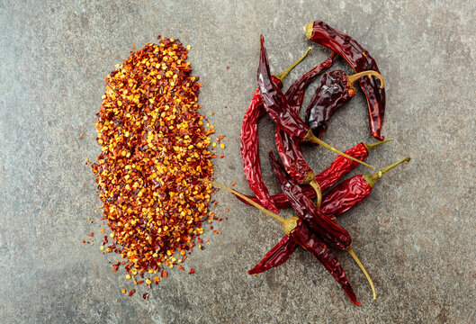 Red hot chili peppers on a stone background.