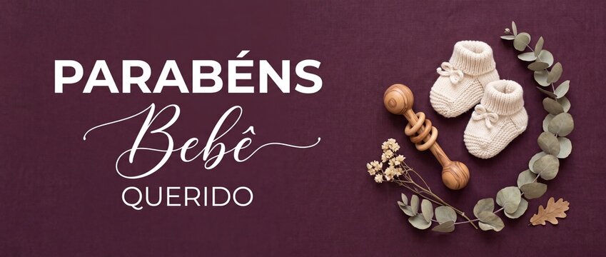 Baby shower congratulations card message with newborn booties and rattle on burgundy background featuring parabens bebe querido text, eucalyptus leaves, wooden toy, and dried flowers for greeting card