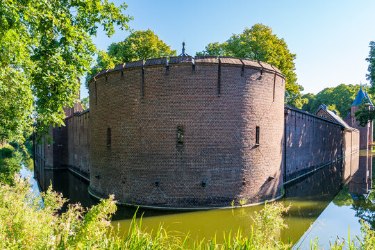 Ancient brick wall around Haar castle surrounded by a moat