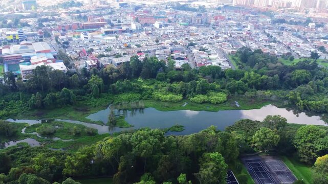 Aerial view wetland Cordoba and Suba road in middle cars moving Bogota, Colombia 4k