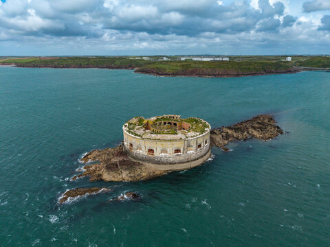 Pembrokeshire, United Kingdom - 17 May 2026: Aerial view of Stack Rock Fort, a historic sea fort situated on a rocky islet surrounded by the waters of the Milford Haven Waterway.