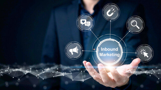 Businessman holding a digital glow of inbound marketing concept with network icons and futuristic connectivity elements