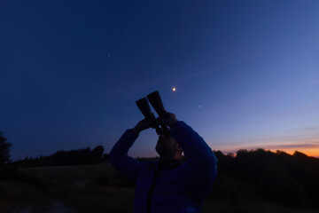 Amateur astronomer observing stars, planets and other celestial objects. © astrosystem
