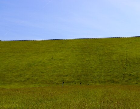 The green grass hill landscape on a sunny day.