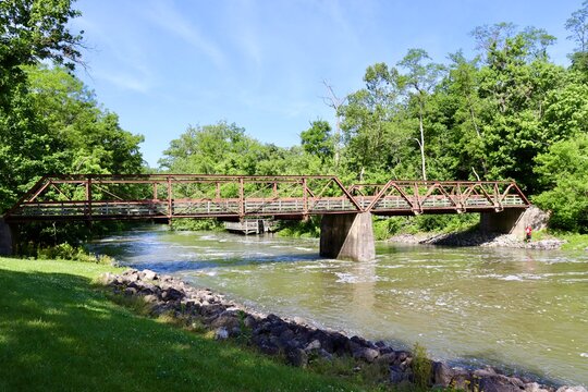 The old steel footbridge over the creek in the park.