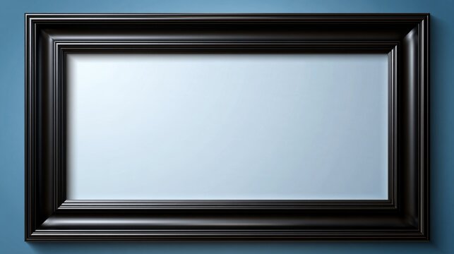 Empty black wooden picture frame mockup hanging on a blue wall
