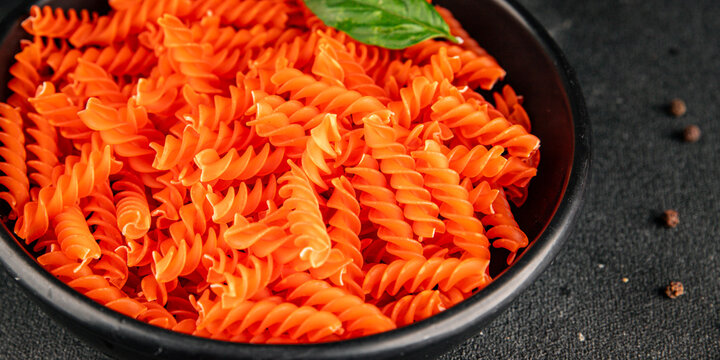 Red lentil pasta fusilli gluten-free fresh pasta healthy eating tasty snack gourmet, rustic food background on the table top view copy space  vegetarian and vegan food