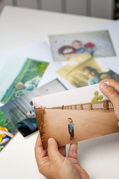 Vintage retro paper photos for photo album laid out on table