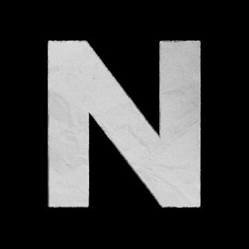 Capital letter N made of textured white paper isolated on black background