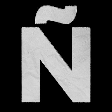 Capital letter &Ntilde; made of textured white paper isolated on black background